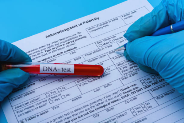 DNA molecule forming inside a blood sample vial used for laboratory analysis, representing accurate procedures required for a court admissible DNA test